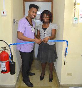 Mercy Hospital's Nursing Supervisor, Mashaun Tyrell and Ministry of Public Health Rep, Caroline Hicks cut the ribbon at the commissioning of the Dialysis Unit